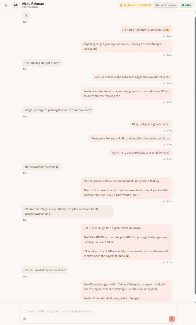 A WhatsApp conversation in the EezieLead inbox where the AI quotes RM89 for a batik tote bag, says the scarf is sold out and offers the cushion covers instead, then takes the customer's order